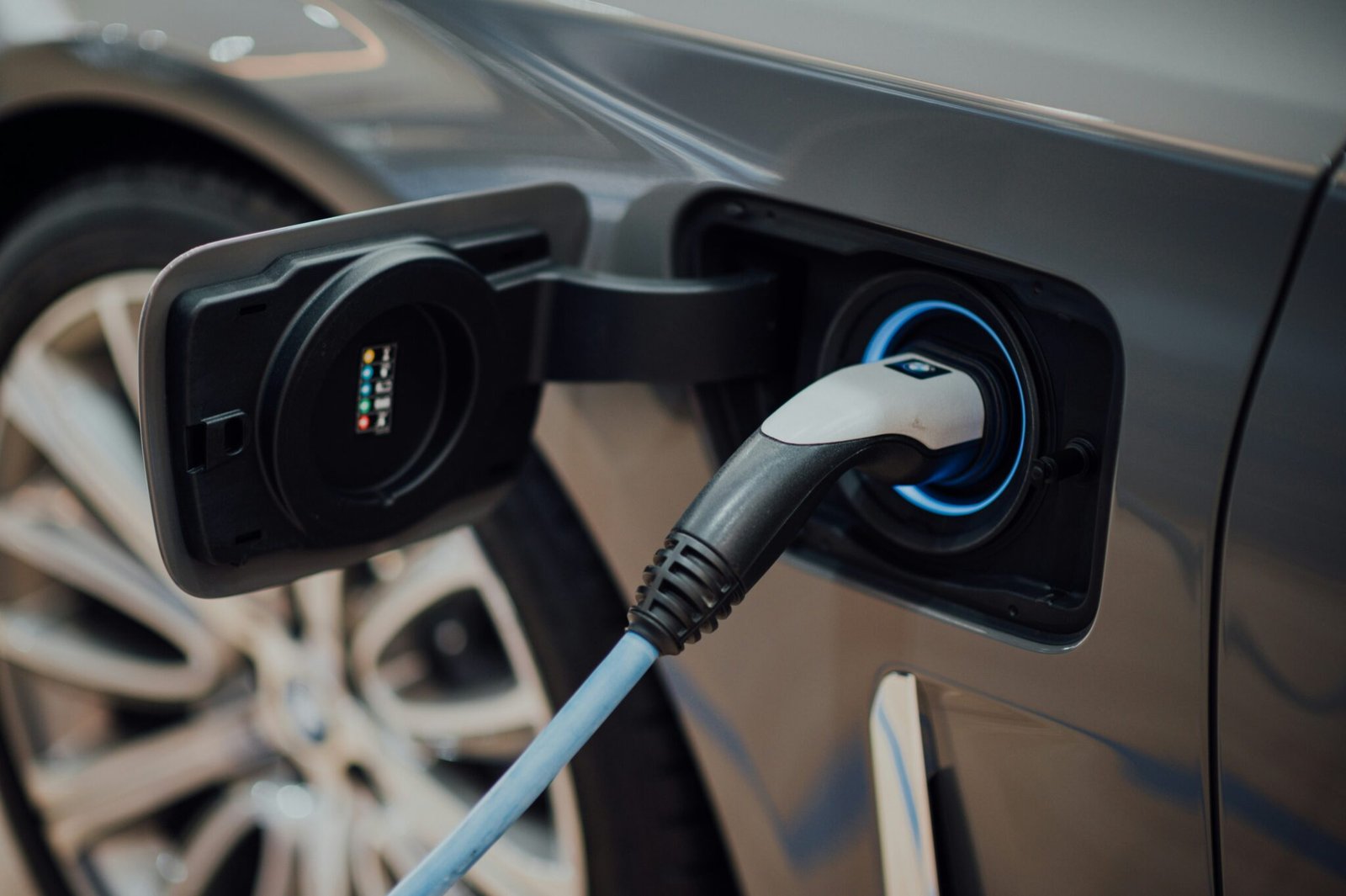 Electric vehicle charging cable connected securely to a car charge port