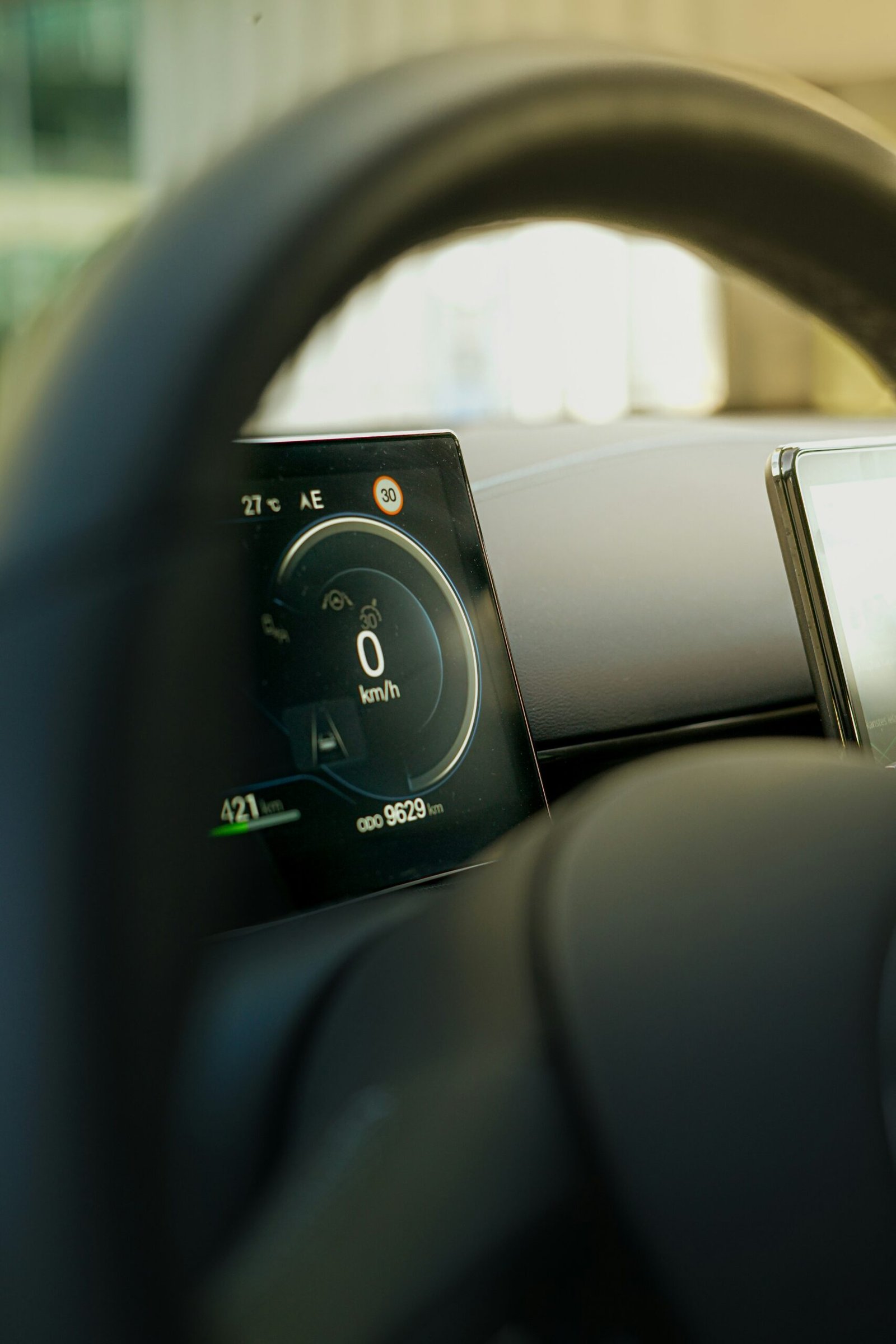 Digital electric vehicle dashboard displaying range, battery level and driving information