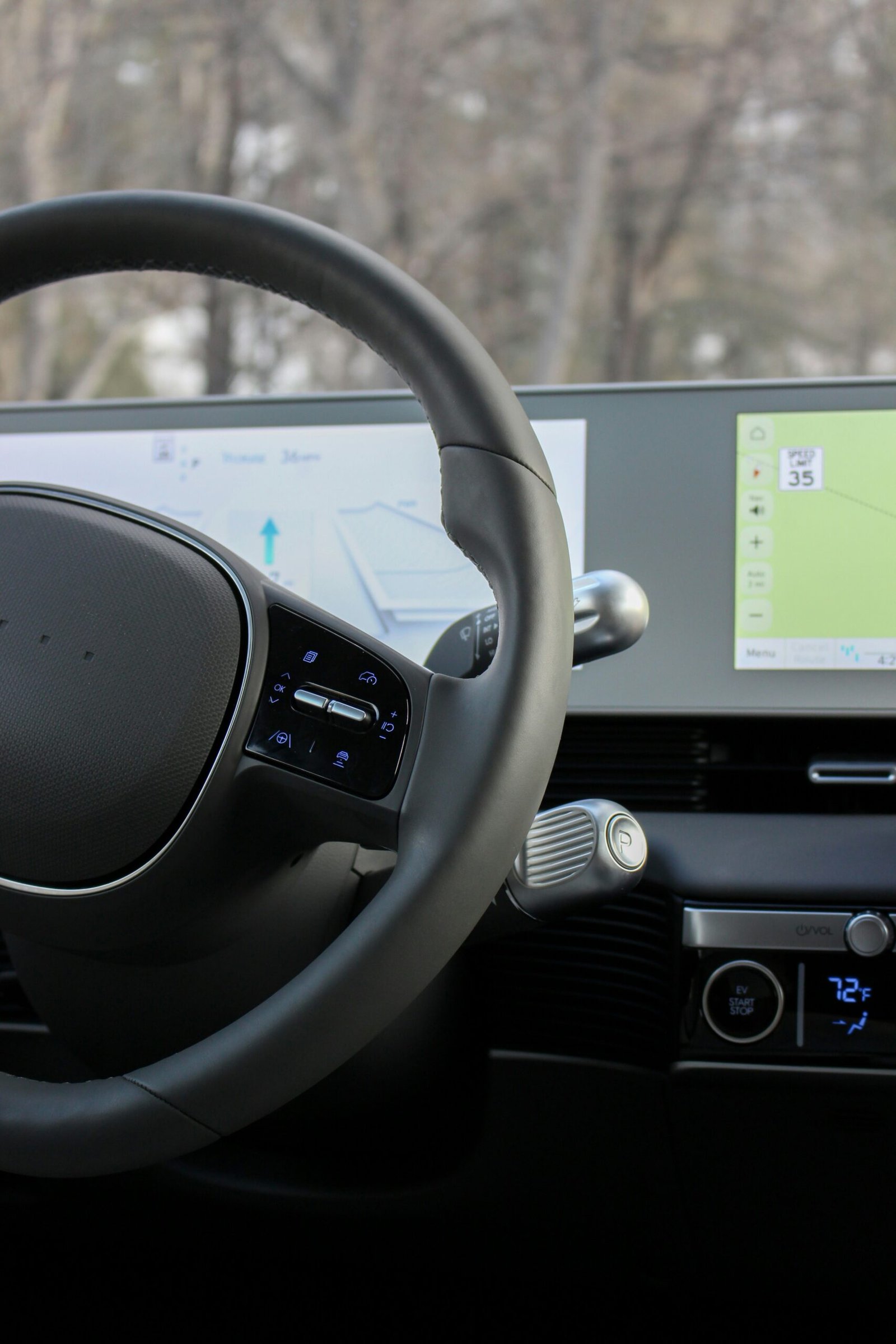 Modern electric vehicle interior with a digital instrument panel and navigation display
